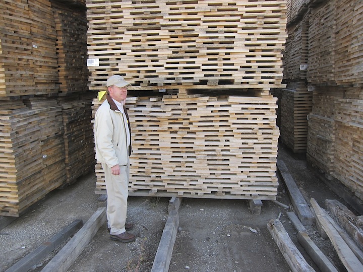 Brown-Forman Master Distiller Chris Morris Stands By Piles Of Drying Oak